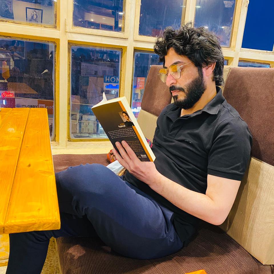 Ibrahim Al-Shabali reading a book