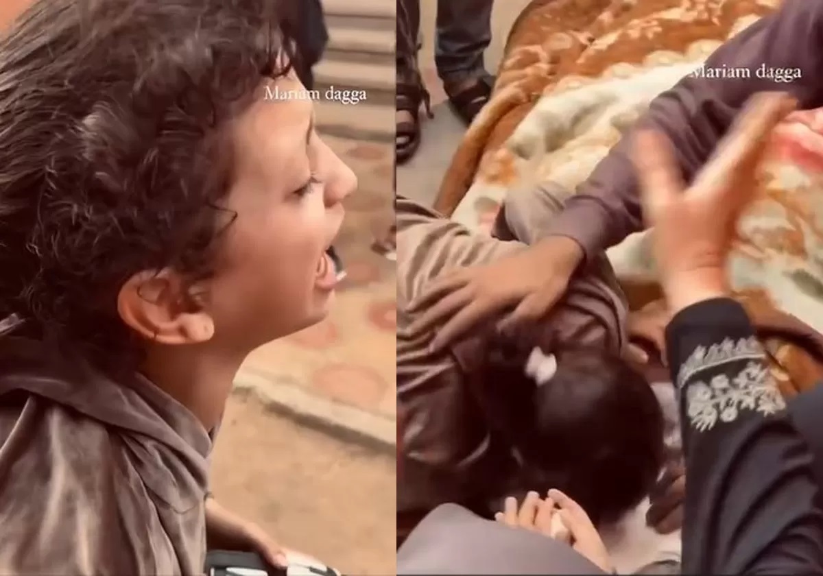 A Palestinian girl bids farewell to her martyr father with tears in Gaza.