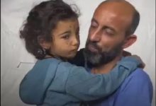 Palestinian doctor accompanied by a little girl