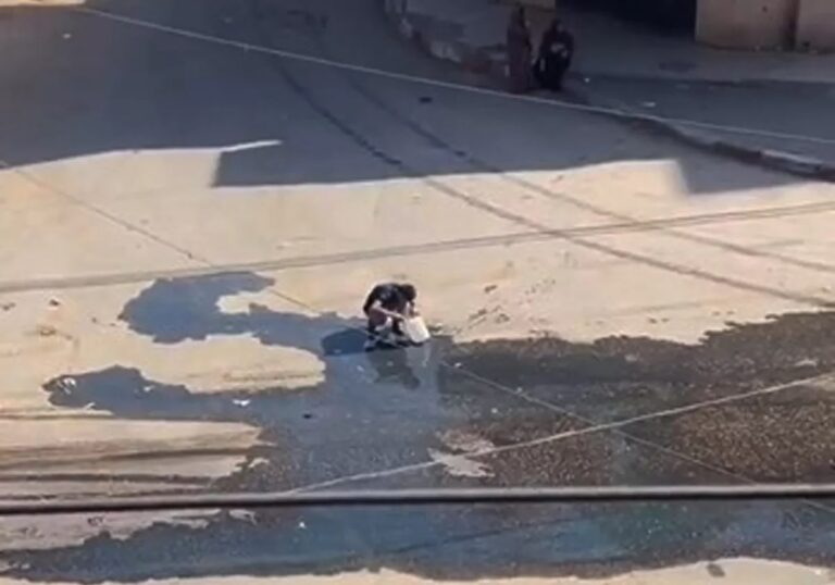 Tragic Video Depicts Palestinian Youth Collecting Spilled Water on Ground Amidst Gaza Blockade