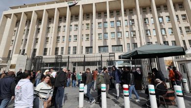 Syrians queue in front of the Central Bank in Damascus to exchange currencies, December 30, 2024.