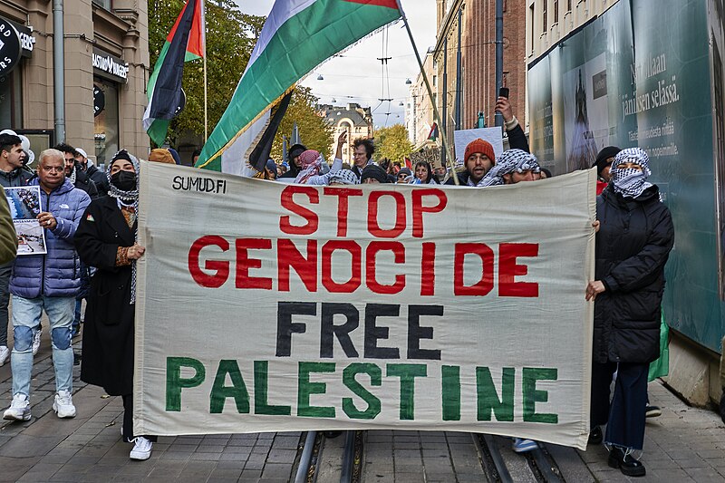 signs against genocide and military actions