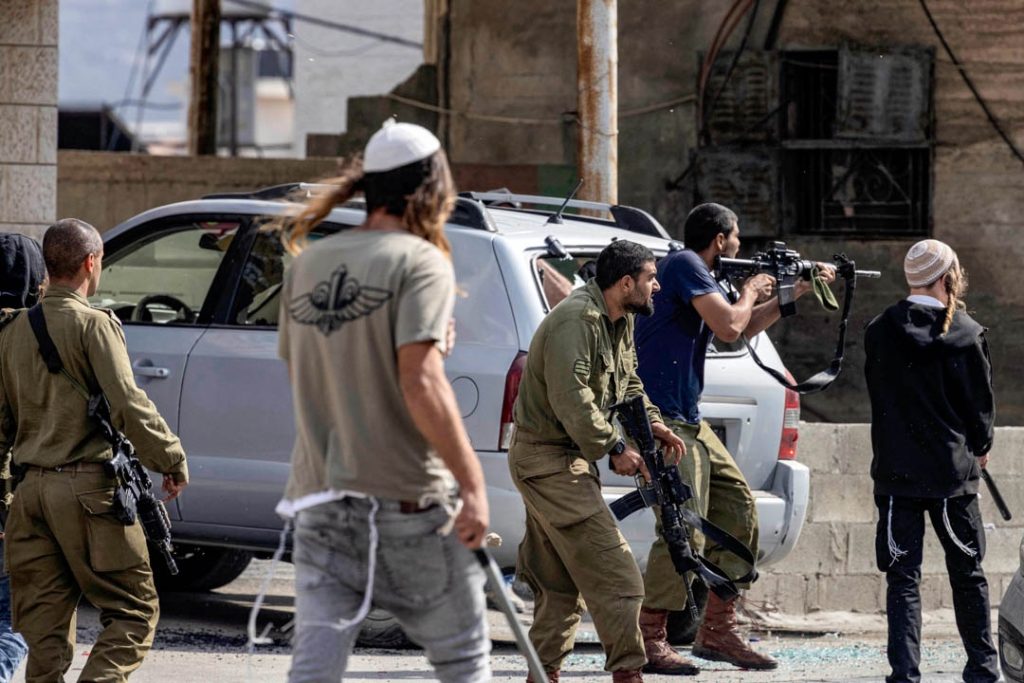 Israeli settlers stopped and disarmed Palestinian police in Ramallah, sparking outrage and security concerns.